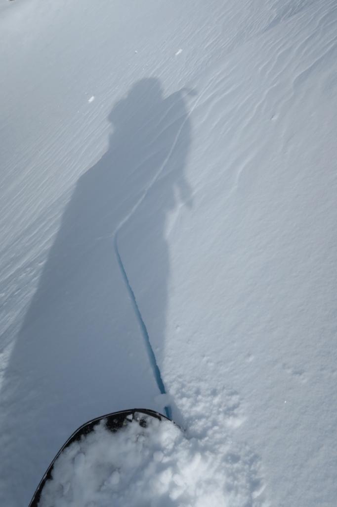  Rider caused cracks in the <a href="/avalanche-terms/wind-slab" title="A cohesive layer of snow formed when wind deposits snow onto leeward terrain. Wind slabs are often smooth and rounded and sometimes sound hollow." class="lexicon-term">wind slab</a>. 