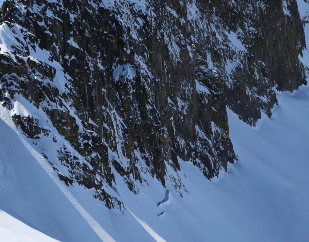  Cracks forming at base of cliffs on steep north facing slope. 