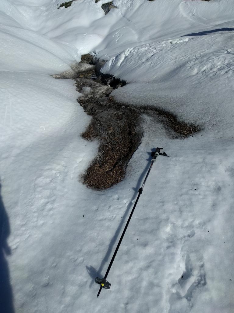  Debris left from water coming up out of the snowpack and flowing across the surface. 