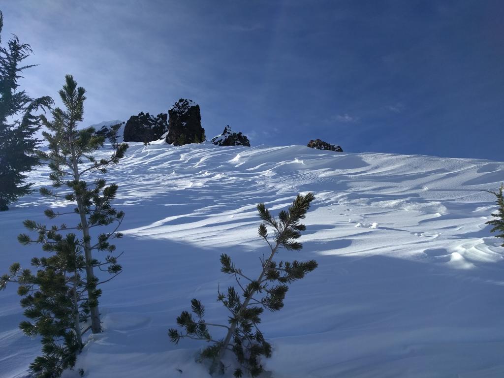  Wind scoured snow on an E <a href="/avalanche-terms/aspect" title="The compass direction a slope faces (i.e. North, South, East, or West.)" class="lexicon-term">aspect</a> at 9800 ft. 