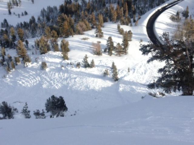  Lookin down to debris from <a href="/avalanche-terms/crown-face" title="The top fracture surface of a slab avalanche. Usually smooth, clean cut, and angled 90 degrees to the bed surface." class="lexicon-term">crown</a> line in far lower left of overview photo. 