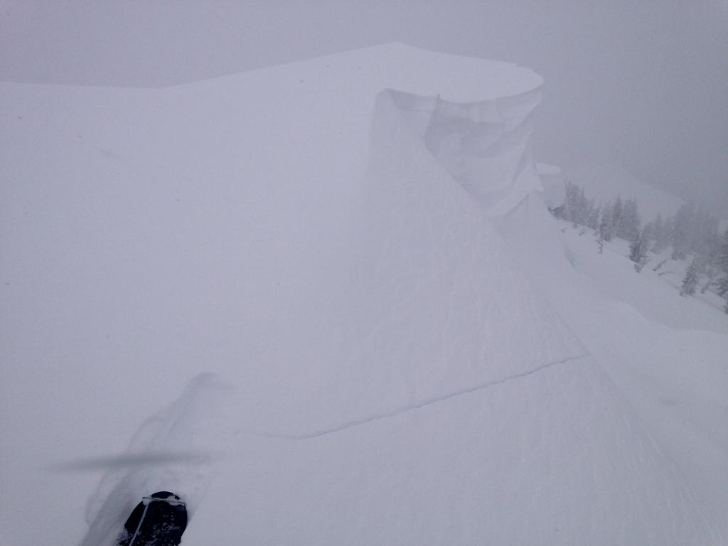  Shooting  crack near summit that released when <a href="/avalanche-terms/trigger" title="A disturbance that initiates fracture within the weak layer causing an avalanche. In 90 percent of avalanche accidents, the victim or someone in the victims party triggers the avalanche." class="lexicon-term">triggered</a> with <a href="/avalanche-terms/cornice" title="A mass of snow deposited by the wind, often overhanging, and usually near a sharp terrain break such as a ridge. Cornices can break off unexpectedly and should be approached with caution." class="lexicon-term">cornice</a> drop 