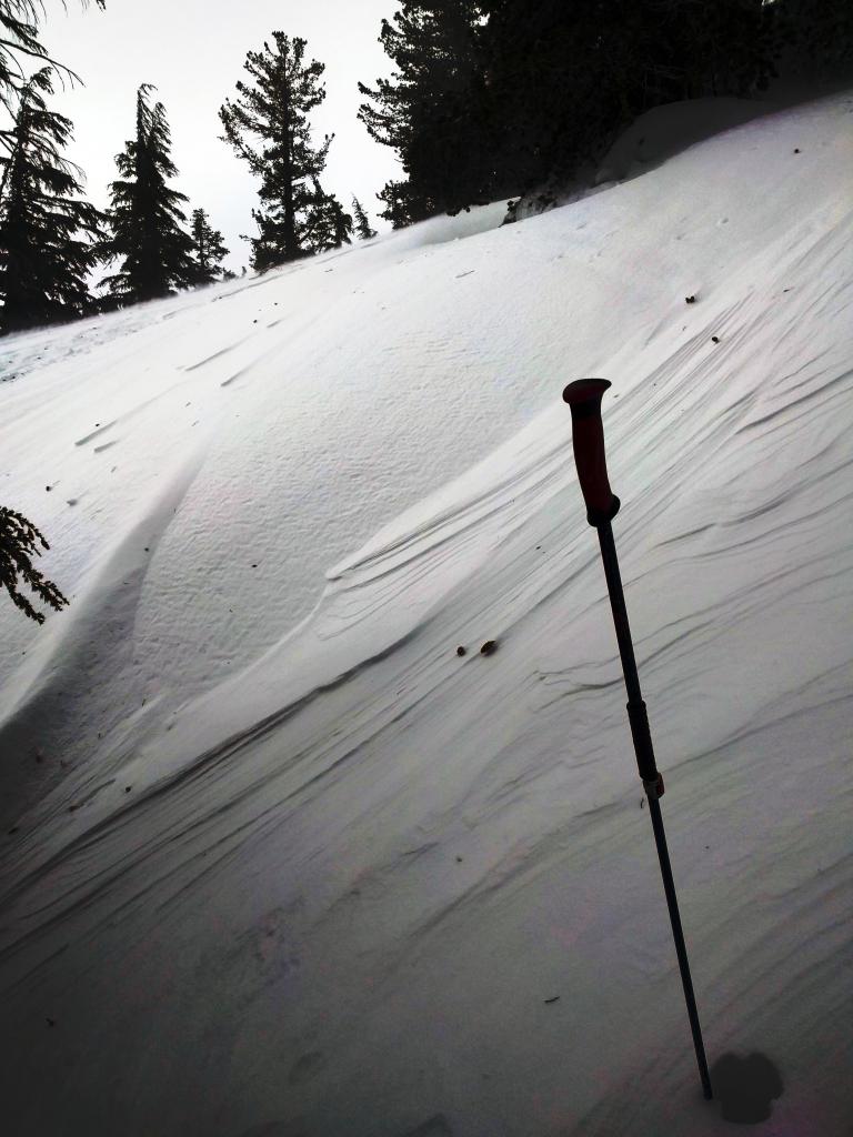  Wind scoured icy crust and wind affected new snow 