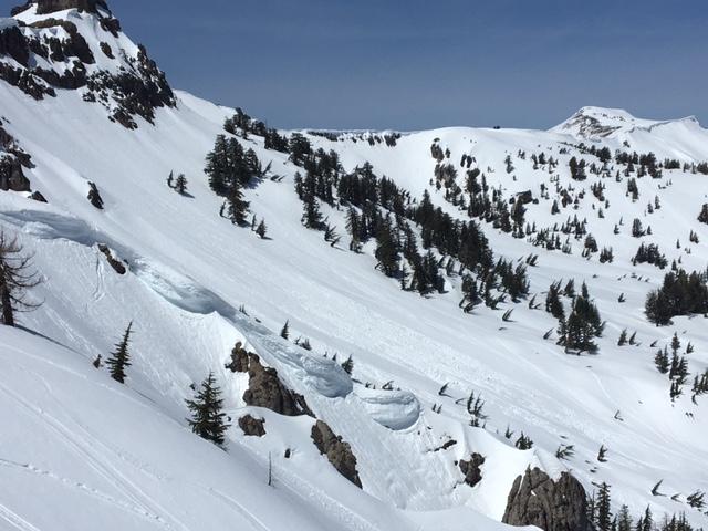  Previous loose wet <a href="/avalanche-terms/avalanche" title="A mass of snow sliding, tumbling, or flowing down an inclined surface." class="lexicon-term">avalanches</a> on N side of Castle Peak. 