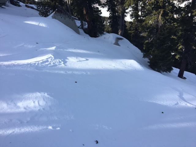  Minor wind scouring on the top 100&#039; of peak.  Large boulders and trees still poking out of snowpack. 