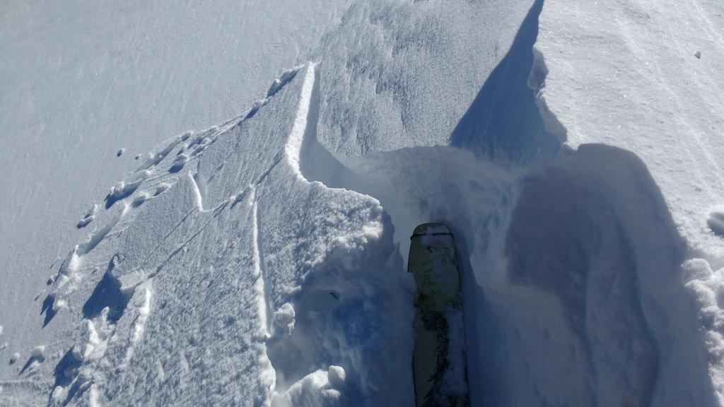  Another intentionally cracked <a href="/avalanche-terms/wind-slab" title="A cohesive layer of snow formed when wind deposits snow onto leeward terrain. Wind slabs are often smooth and rounded and sometimes sound hollow." class="lexicon-term">wind slab</a> along summit ridge near noted lat/long. 