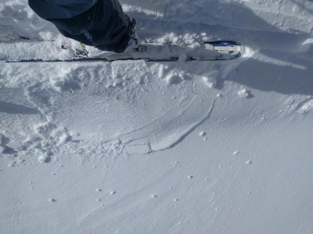  Minor cracks that barely extend away from my skis on a traditionally wind-<a href="/avalanche-terms/loading" title="The addition of weight on top of a snowpack, usually from precipitation, wind drifting, or a person." class="lexicon-term">loaded</a> test slope on Andesite Peak. 