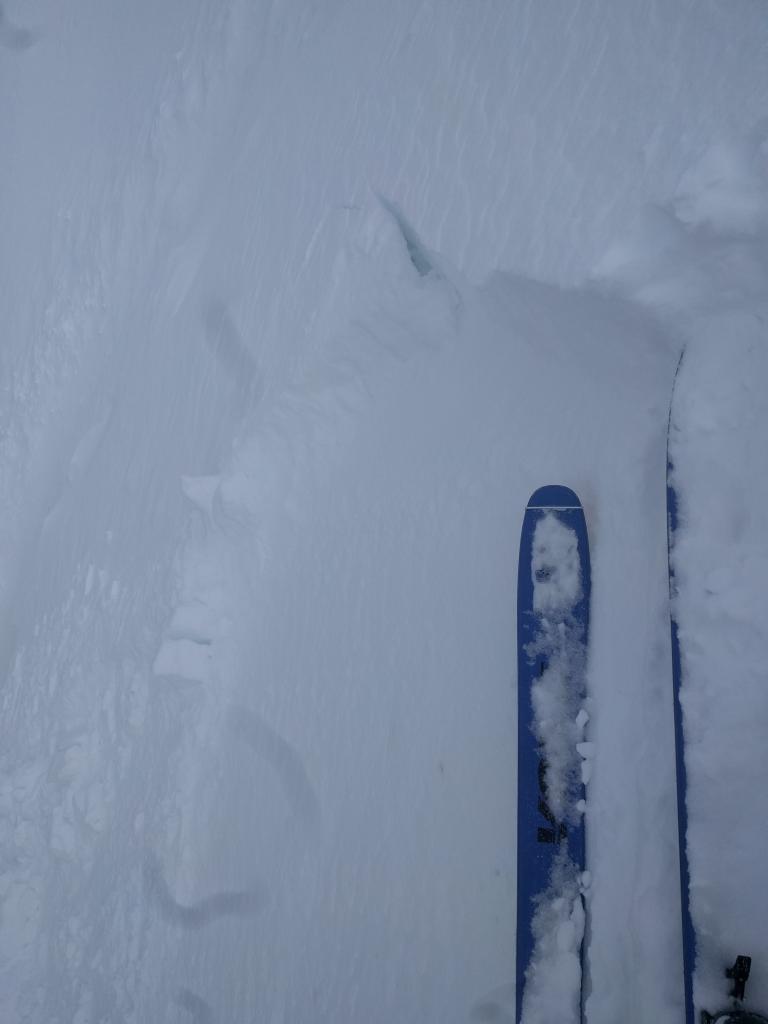  Small <a href="/avalanche-terms/wind-slab" title="A cohesive layer of snow formed when wind deposits snow onto leeward terrain. Wind slabs are often smooth and rounded and sometimes sound hollow." class="lexicon-term">wind slab</a> <a href="/avalanche-terms/trigger" title="A disturbance that initiates fracture within the weak layer causing an avalanche. In 90 percent of avalanche accidents, the victim or someone in the victims party triggers the avalanche." class="lexicon-term">triggered</a> by a ski kick on a wind-<a href="/avalanche-terms/loading" title="The addition of weight on top of a snowpack, usually from precipitation, wind drifting, or a person." class="lexicon-term">loaded</a> test slope on the far east ridge of Tamarack Peak. 