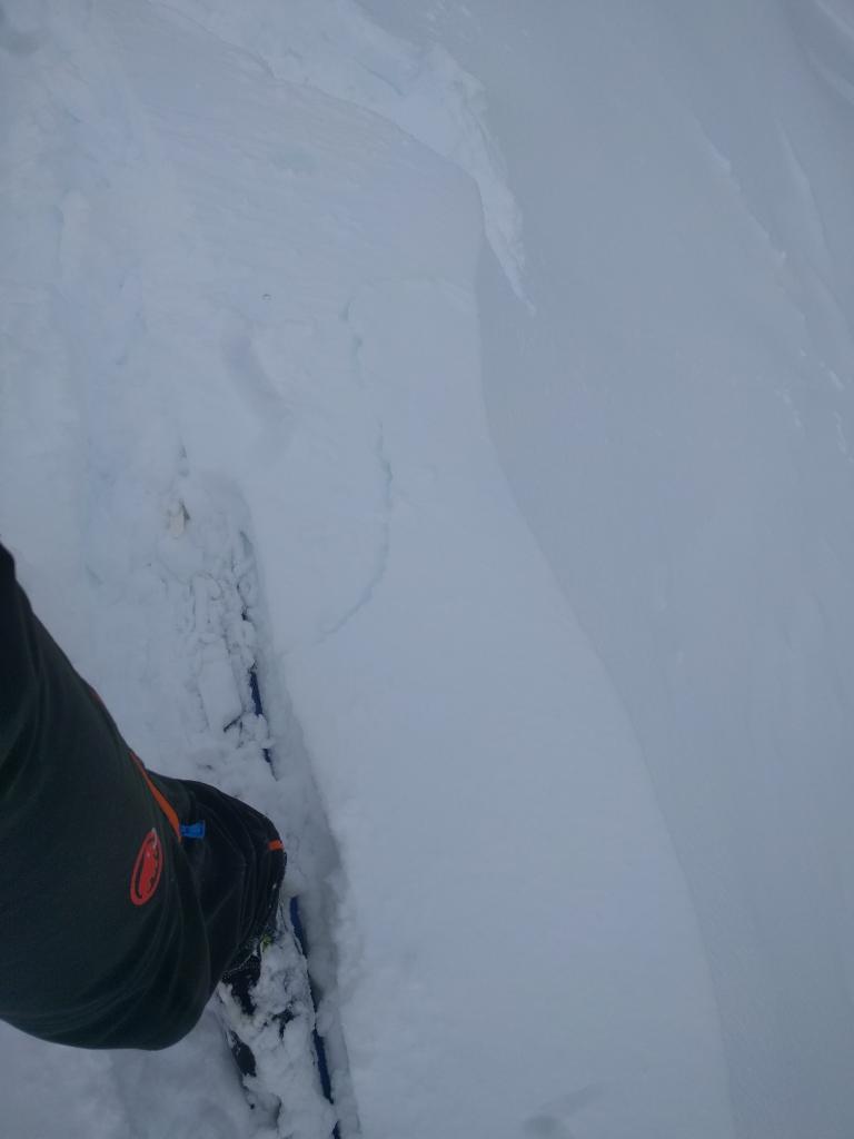  Small cracking on above a ENE wind-<a href="/avalanche-terms/loading" title="The addition of weight on top of a snowpack, usually from precipitation, wind drifting, or a person." class="lexicon-term">loaded</a> slope near the summit of Andesite 