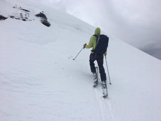  Examining new <a href="/avalanche-terms/wind-slab" title="A cohesive layer of snow formed when wind deposits snow onto leeward terrain. Wind slabs are often smooth and rounded and sometimes sound hollow." class="lexicon-term">wind slab</a> of less than 2 inches deep and less than 6 foot downhill extent. 