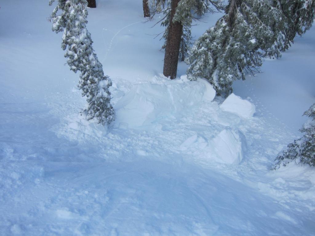  Main chunk of broken <a href="/avalanche-terms/cornice" title="A mass of snow deposited by the wind, often overhanging, and usually near a sharp terrain break such as a ridge. Cornices can break off unexpectedly and should be approached with caution." class="lexicon-term">cornice</a> (approximately size of a skinny van). 