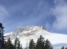 Rime or snow dusting southwest aspect of Stevens Peak.