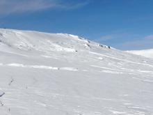 NE wind scouring at 8200' E aspect of peak. 