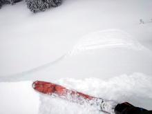 Loose dry sluff triggered by a small cornice dropped onto the slope.