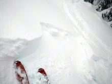 The wind loaded test slope that cracked and failed with a hard ski kick after previously being undercut.