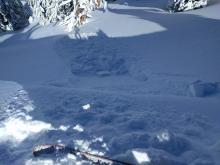 Cornice piece dropped onto a wind-loaded slope. It only triggered  sluffing  in the new snow and rolled down the slope.