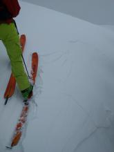 Cracking on a wind-loaded S facing test slope near the summit of Incline Lake Peak.