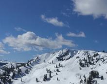 Large cornices with old debris on Echo Peak looking ominous during the warmth of the day.