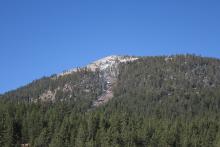Snow almost nonexistent on lower elevation east face of Waterhouse peak. 