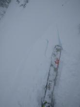 Skier triggered cracking on a wind-loaded test slope on an E aspect at 9700 ft.