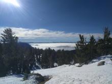  Inversion conditions allowing cold air and clouds to remain trapped at the lower elevations.