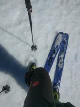 1 inch of soft wet corn snow on top of a supportable melt-freeze crust on a S aspect at 8850 ft. around 11:30 am.