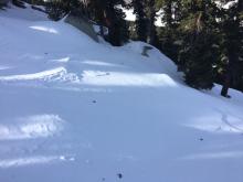 Minor wind scouring on the top 100' of peak.  Large boulders and trees still poking out of snowpack.
