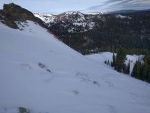 Scoured surfaces on exposed slopes in above treeline terrain.