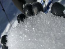 Surface hoar on top of a frozen rain crust in a sheltered meadow at 7600 ft.