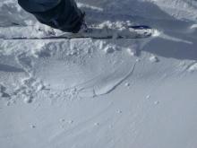 Minor cracks that barely extend away from my skis on a traditionally wind-loaded test slope on Andesite Peak.