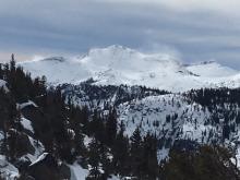 Obvious plumes of blowing snow on Dick's Peak as seen from the saddle on the S side of Rubicon's summit.