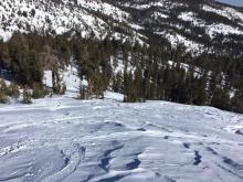 Some wind scouring on the snow surface near ridgeline.