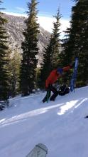 Snowpit location at 9,000' with 1.3m deep snowpack on a N aspect and mostly bare ground on S aspects in the background.