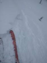 Skier triggered wind slab on a slope that had previously slid.