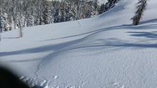 Photo taken from triggering snowpit location. These cracks ran 500' over to steeper terrain where it remotely triggered this avalanche beyond the view of this photo.  Shooting cracks continued and went a total of 1000' away from this spot into lower angle terrain on the other side of the avalanche.