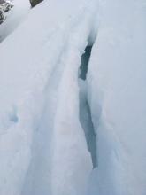 Large crack behind where a cornice had partially broken away. This was covered by snow.