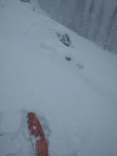 Shooting crack from lower angle terrain that then becomes a wind slab avalanche in the nearby steeper terrain.