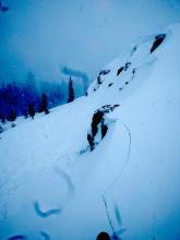 Wind slab failure on a test slope caused by the natural collapse of a cornice.