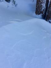 Wind affected snow below treeline (but nearing summit ridge).