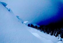 Large cornices along summit ridge. Note the cracked settlement cones on the trees.