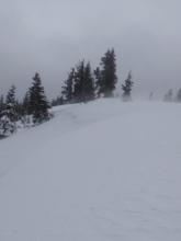 NE winds scouring cornices and drifting snow over the ridgetop.