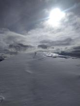 Large cracks behind cornices from previous natural cornice failures.