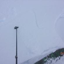 3x3 foot 4 inch deep wind slab breaking, near cornice photo, on the ascent.