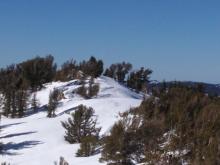 Cornices eroded by NE winds along the summit ridge.