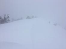 Blowing snow with limited visibility at 9200'.