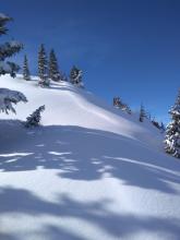 Wind pillow above NE aspect terrain at the summit.