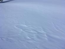 Minor wind effect observed at the saddle near the summit. Snow was still very soft.