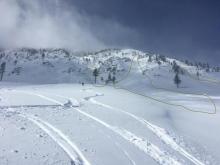 Evidence of partially buried avalanche debris is highlighted