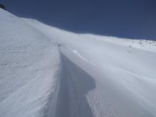 Crown refilled by 6 inches of storm snow. Entrance tracks faintly visible from upper right.