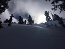 Increasing clouds and wind transport observed along ridges near peak top.